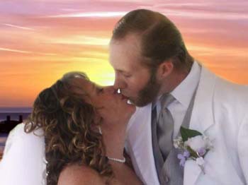 Couple kissing at sunset